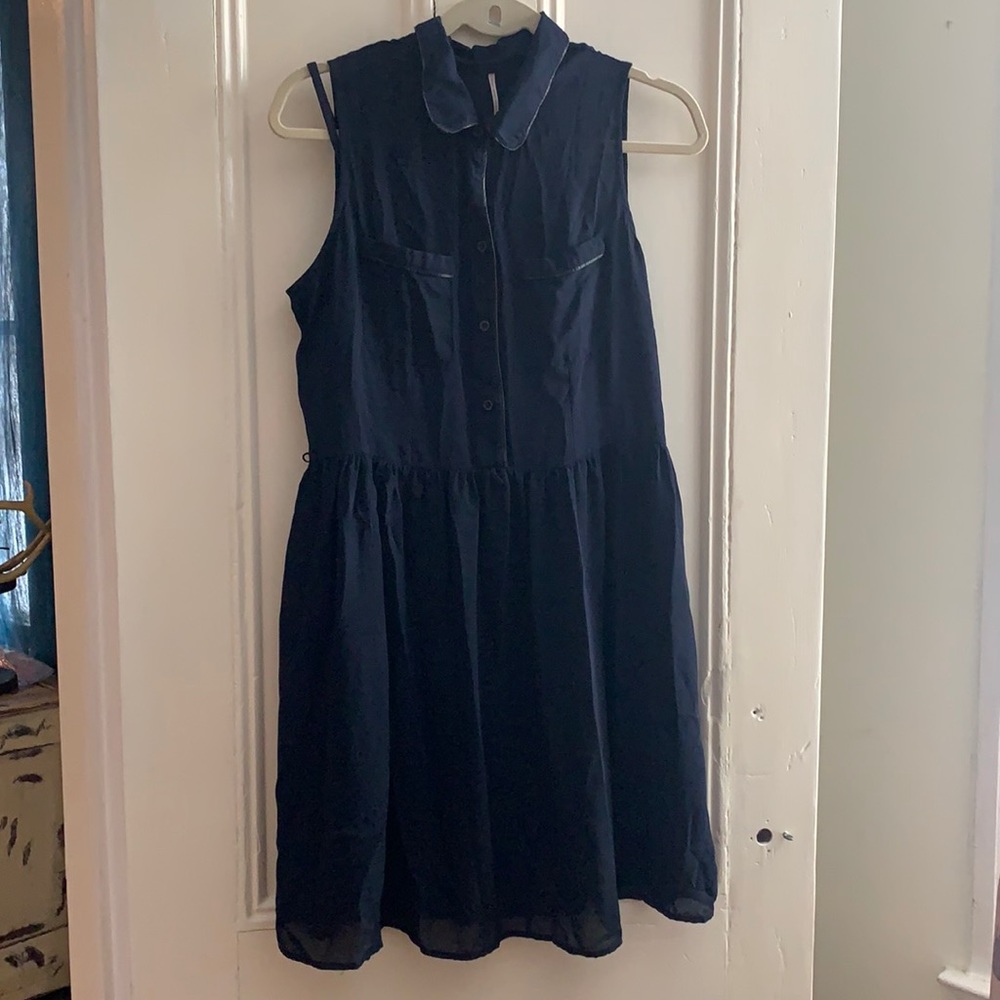 Navy blue dress with buttons.